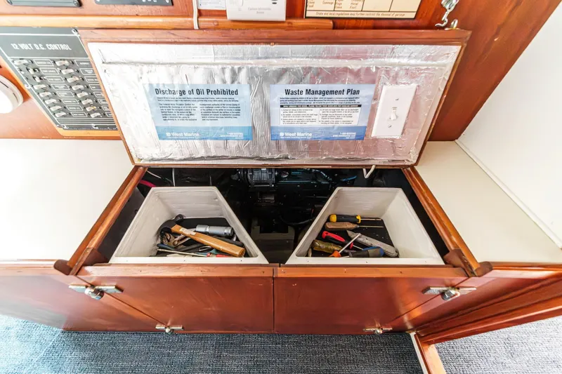 Slide: The Image of Interior of 1992 Morgan 45 Catalina with tool storage and waste management plan. - 60