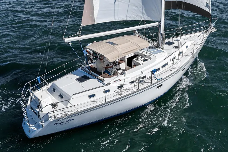 Slide: The Image of Sailing yacht Morgan 45 Catalina 1992 cruising on open water. - 9