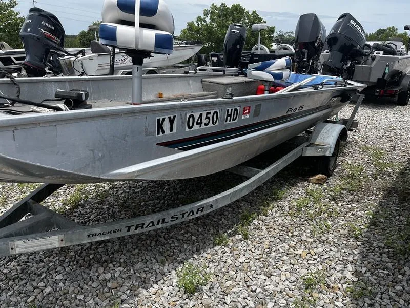 The Image of 1996 Tracker Pro 15 boat on a Trailstar trailer, parked on gravel. - 0