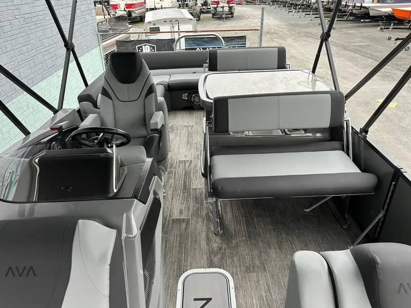 Slide: The Image of 2025 Avalon 2585 Catalina Entertainer boat interior with gray seating and modern design. - 10