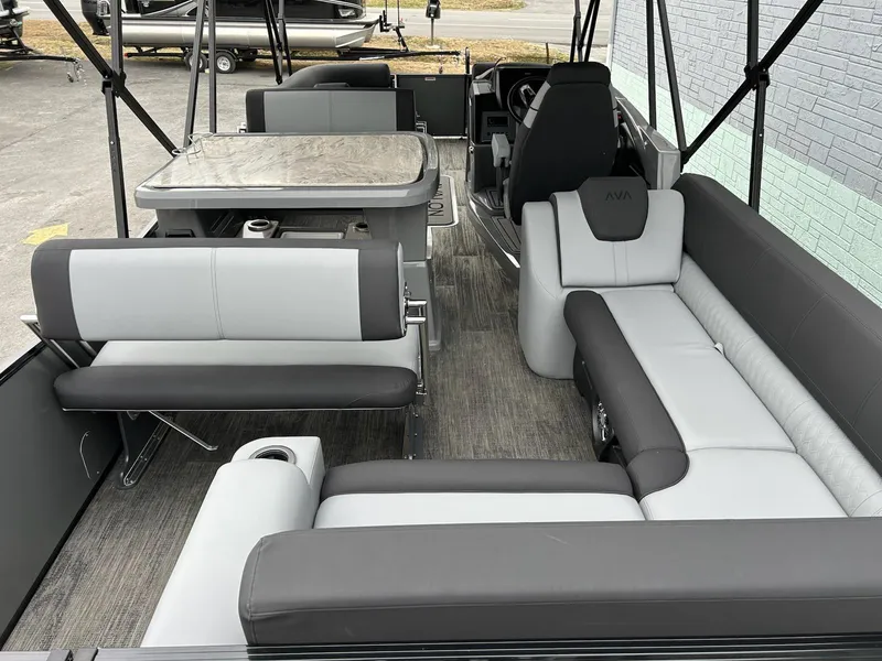 Slide: The Image of 2025 Avalon 2585 Catalina Entertainer boat interior with gray seating and open canopy. - 15