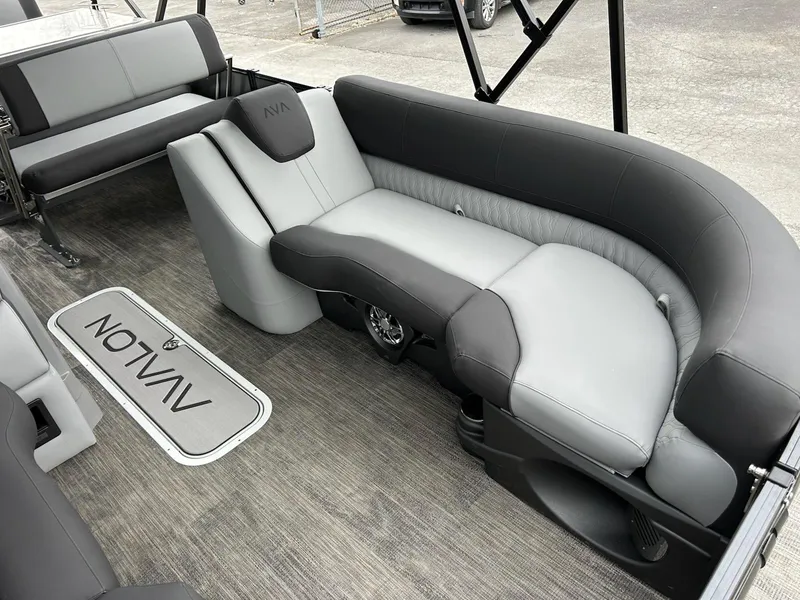 Slide: The Image of 2025 Avalon 2585 Catalina Entertainer boat interior with modern seating and steering console. - 7