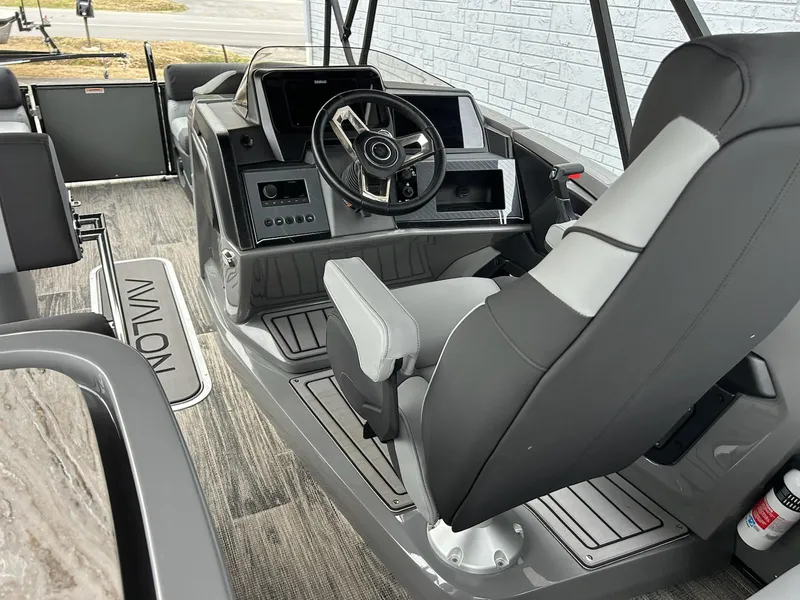 Slide: The Image of 2025 Avalon 2585 Catalina Entertainer boat interior with sleek seating and modern design. - 9
