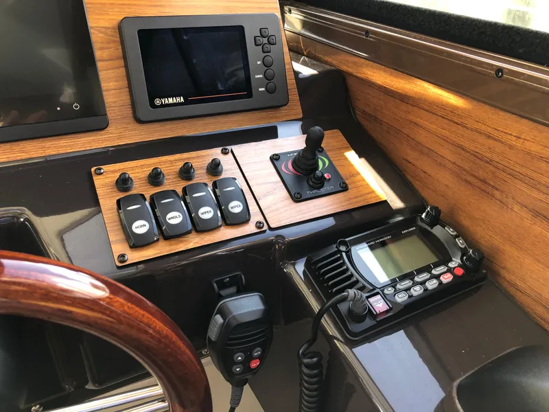 Slide: The Image of Control panel of 2022 Ranger Tugs R-27 with navigation and communication equipment. - 6