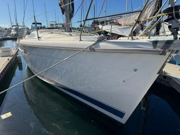 Slide: The Image of Sailboat docked in marina, 1996 Hunter 376 model, white hull, clear blue sky. - 10