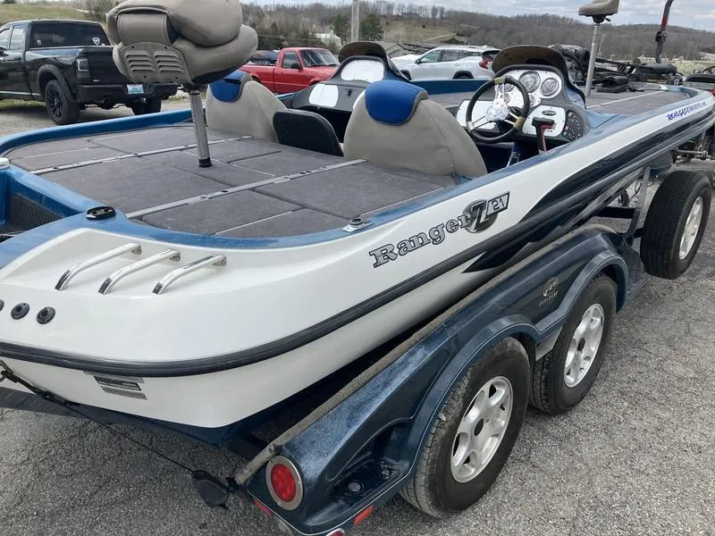 Slide: The Image of 2006 Ranger Z21 boat on trailer, featuring dual seats and steering console. - 5