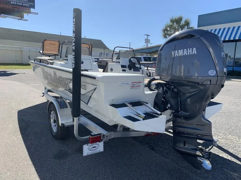 Slide: The Image of SeaArk Easy 200 boat, 2025 model, with Yamaha outboard motor, parked on a trailer. - 1