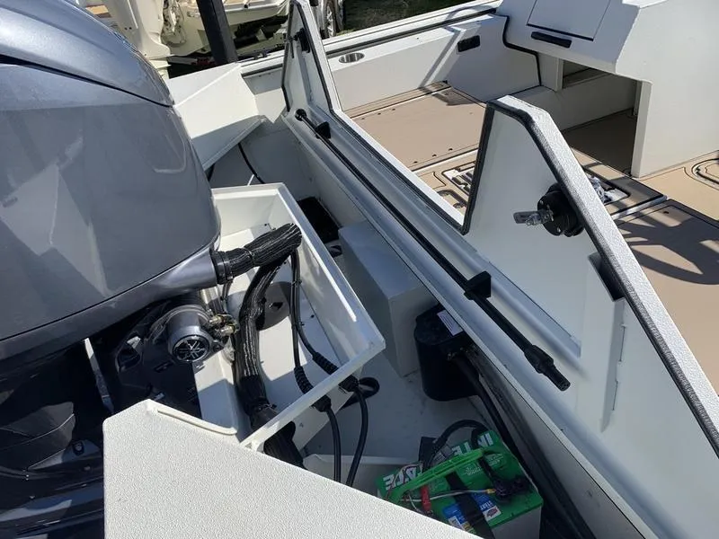 Slide: The Image of 2025 SeaArk Easy 200 boat interior with motor and storage compartments. - 10