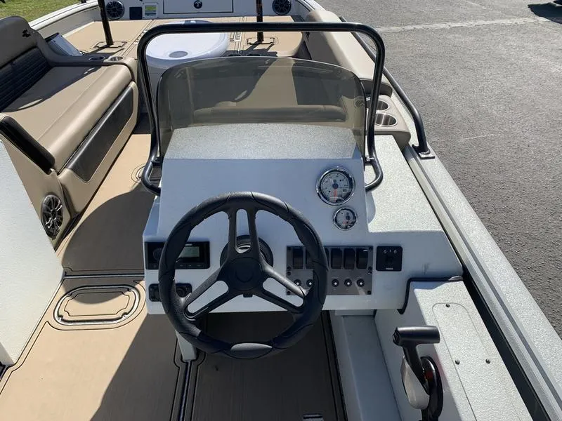 Slide: The Image of 2025 SeaArk Easy 200 boat dashboard with steering wheel and gauges. - 15