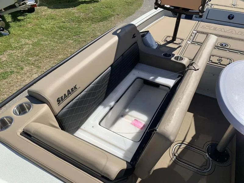 Slide: The Image of 2025 SeaArk Easy 200 boat interior with cushioned seating and cup holders. - 21