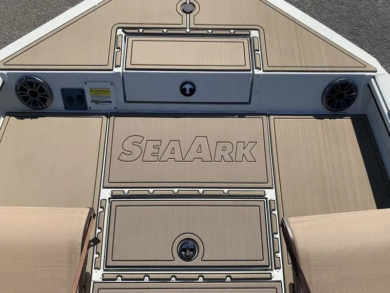 Slide: The Image of 2025 SeaArk Easy 200 boat deck with storage compartments and speakers. - 25