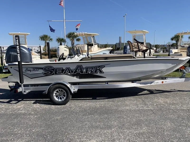Slide: The Image of 2025 SeaArk Easy 200 boat on trailer, parked outdoors, with Yamaha engine. - 4