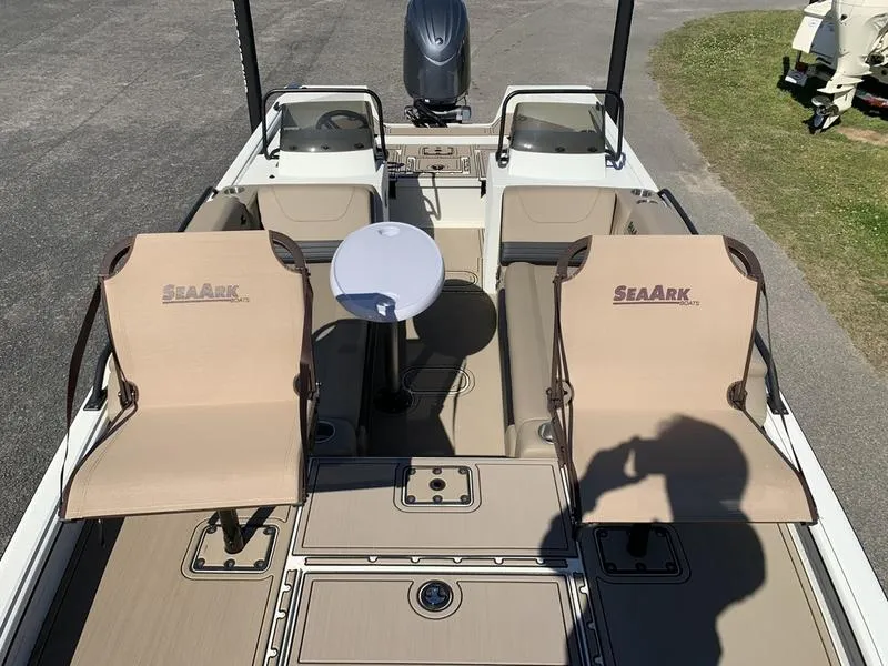 Slide: The Image of 2025 SeaArk Easy 200 boat interior with seating and table, viewed from above. - 8