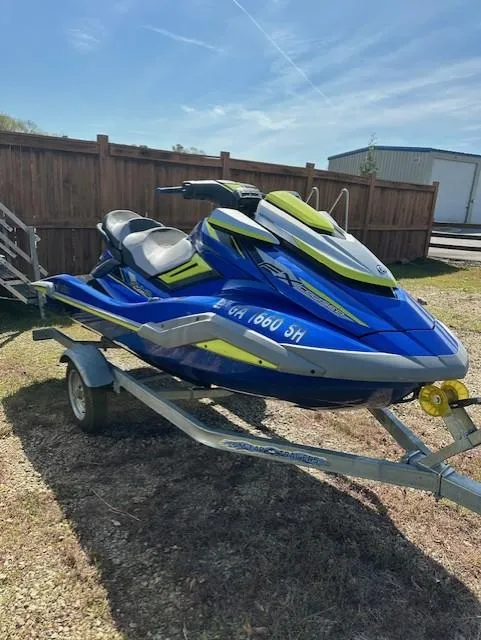 Slide: The Image of 2020 Yamaha WaveRunner FX Cruiser SVHO on trailer, blue and yellow, parked outdoors. - 5