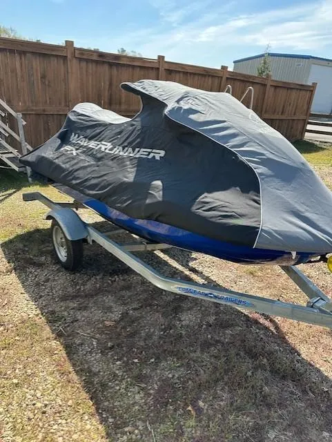 Slide: The Image of 2020 Yamaha WaveRunner FX Cruiser SVHO covered on a trailer, parked outdoors. - 9