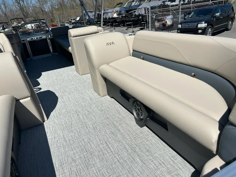 Slide: The Image of 2025 Avalon 2380 VLS Quad Lounger interior with beige seating and spacious layout. - 5