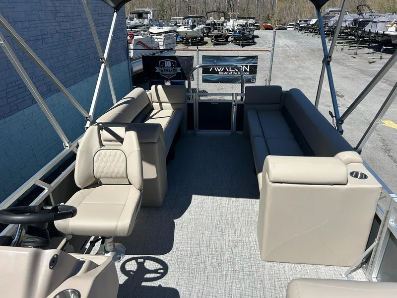 Slide: The Image of 2025 Avalon 2380 VLS Quad Lounger pontoon boat with spacious seating and canopy. - 7