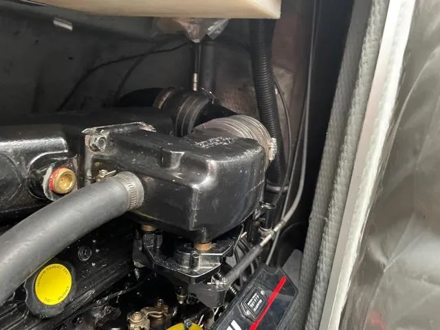 Slide: The Image of Engine compartment of a 1994 Rinker Fiesta Vee 265 boat. - 16