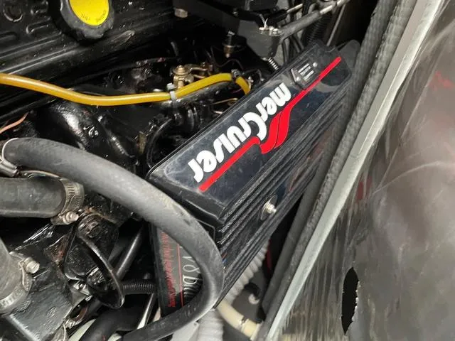 Slide: The Image of Engine compartment of 1994 Rinker Fiesta Vee 265 with MerCruiser components. - 17
