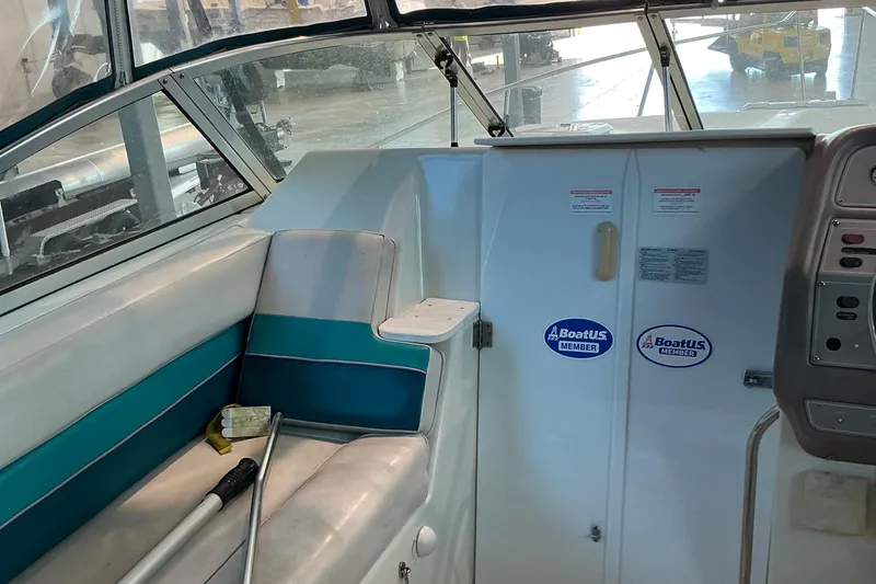 Slide: The Image of Interior of 1994 Rinker Fiesta Vee 265 boat with seating and control panel. - 31