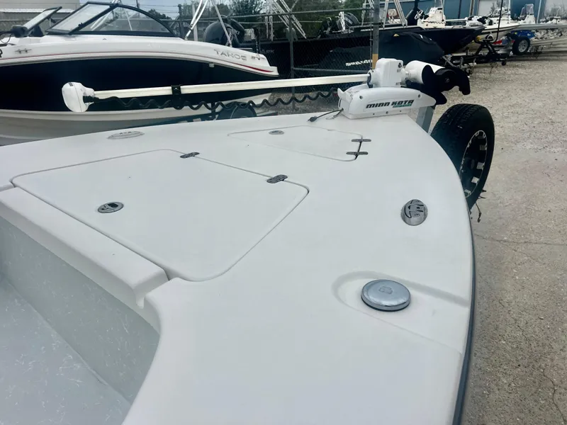 Slide: The Image of 2015 Blazer Bay 2220 GTS boat deck with storage compartments and trolling motor. - 3