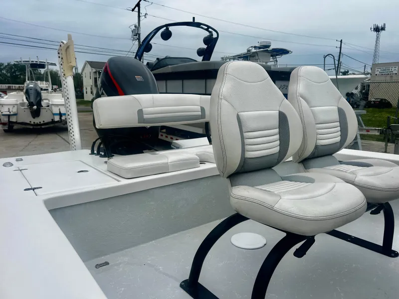 Slide: The Image of 2015 Blazer Bay 2220 GTS boat with dual cushioned seats and sleek design. - 4