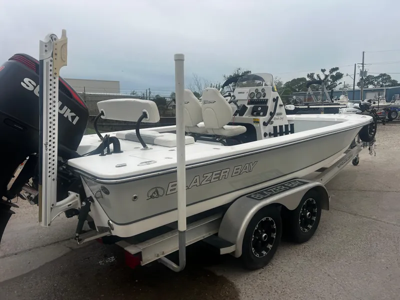 Slide: The Image of 2015 Blazer Bay 2220 GTS boat on trailer with Suzuki outboard motor. - 7