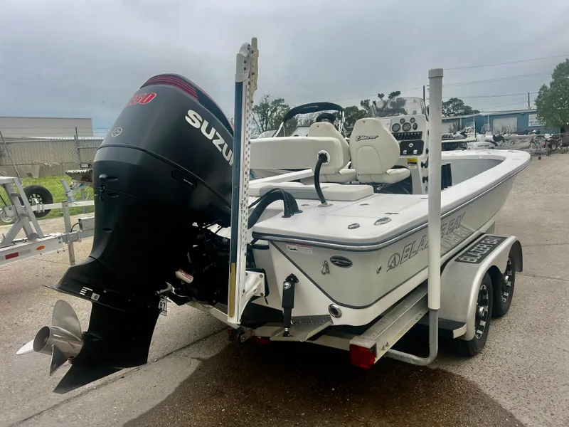 Slide: The Image of 2015 Blazer Bay 2220 GTS boat with Suzuki outboard motor on trailer. - 8