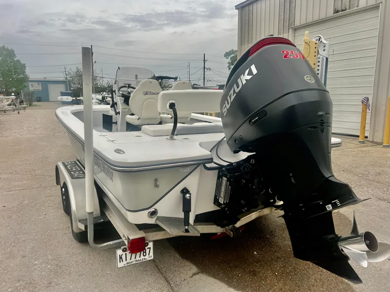 Slide: The Image of 2015 Blazer Bay 2220 GTS boat with Suzuki outboard motor on trailer. - 9