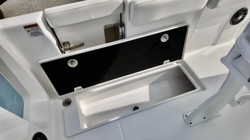 Slide: The Image of Storage compartment on 2025 Sea Fox 268 Commander boat, featuring sleek white interior design. - 12
