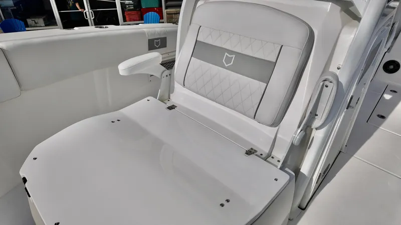 Slide: The Image of 2025 Sea Fox 268 Commander boat seat with armrest and quilted design. - 13