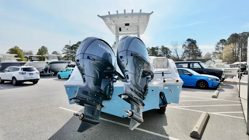 Slide: The Image of 2025 Sea Fox 268 Commander with dual Yamaha outboard motors in a parking lot. - 3