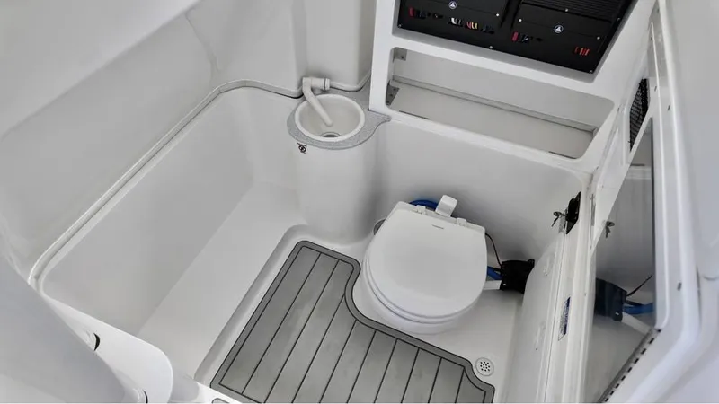 Slide: The Image of 2025 Sea Fox 268 Commander boat interior with compact marine toilet and sink. - 20