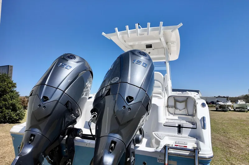 Slide: The Image of 2026 Sea Fox 268 Commander with dual 150 horsepower engines, showcased outdoors. - 23
