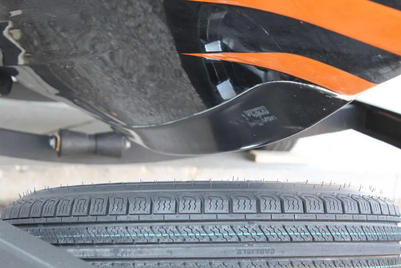 Slide: The Image of 2018 Phoenix 721 ProXP boat hull with trailer tire detail. - 17