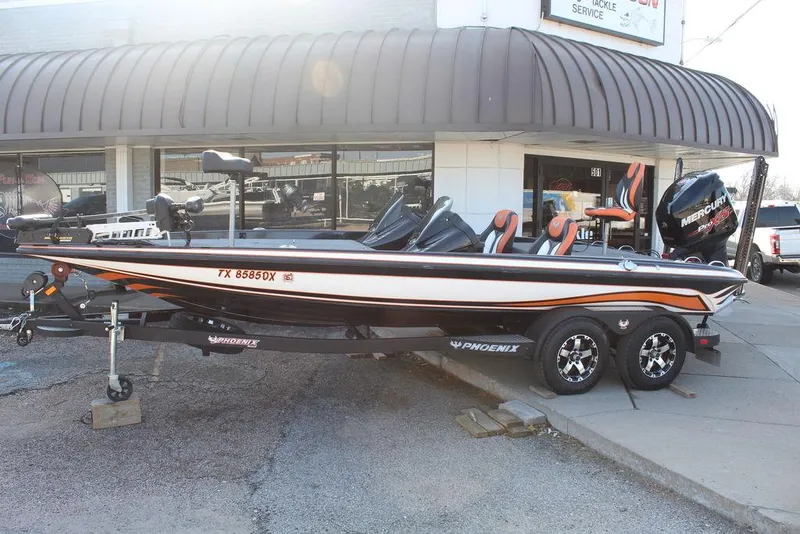 Slide: The Image of 2018 Phoenix 721 ProXP boat on trailer, parked outside a dealership. - 3