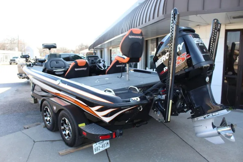Slide: The Image of 2018 Phoenix 721 ProXP bass boat with Mercury engine, parked on a trailer. - 4