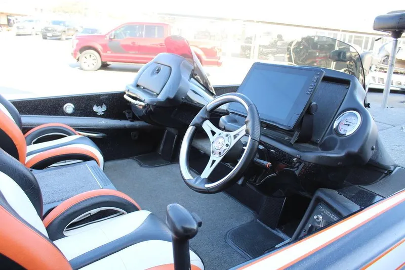 Slide: The Image of 2018 Phoenix 721 ProXP boat interior with steering wheel and dashboard display. - 8