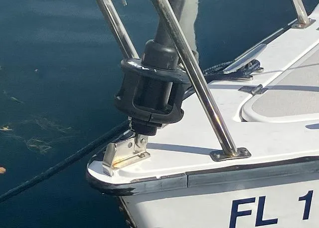 Slide: The Image of Close-up of a 2013 Colgate Sloop's bow with visible rigging and water reflection. - 4