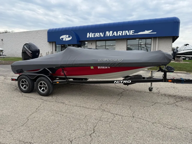Slide: The Image of 2015 Nitro Z Series Z-7 boat with cover, parked at Hern Marine dealership. - 1