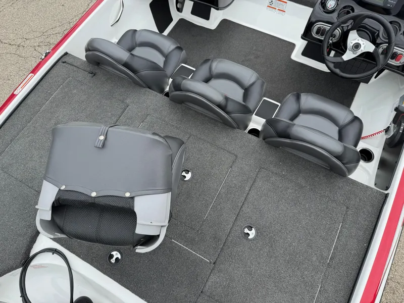 Slide: The Image of 2015 Nitro Z Series Z-7 boat interior with four black seats and steering wheel. - 5