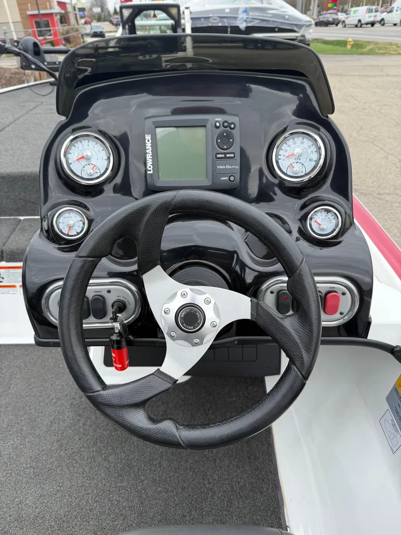 Slide: The Image of Steering console of 2015 Nitro Z Series Z-7 boat with gauges and controls. - 8