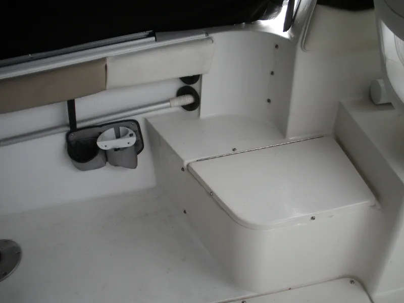 Slide: The Image of 2004 Seaswirl Striper 2101 Walkaround I/O boat interior with seating and storage compartments. - 11
