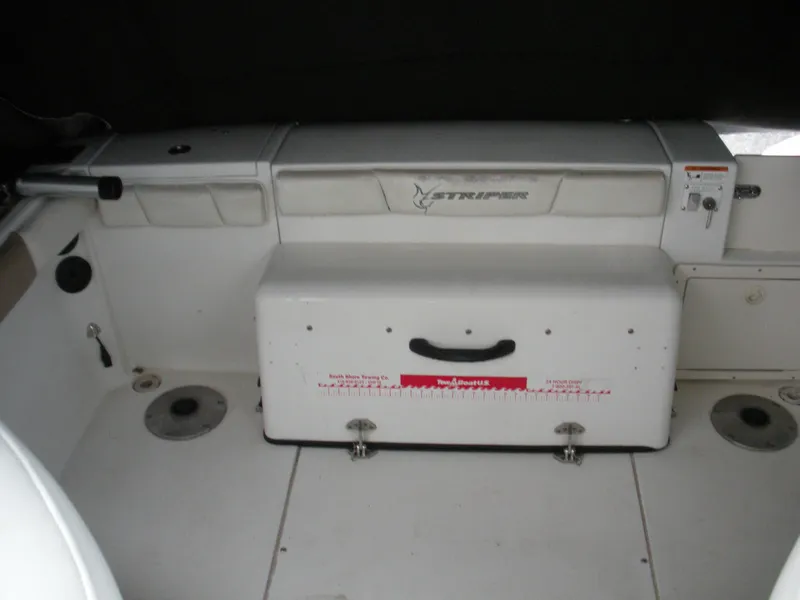 Slide: The Image of 2004 Seaswirl Striper 2101 Walkaround I/O boat interior with storage compartments. - 13