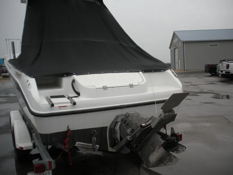 Slide: The Image of 2004 Seaswirl Striper 2101 Walkaround I/O boat with black cover, parked on trailer. - 15