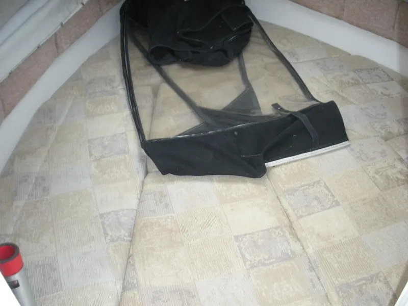 Slide: The Image of 2004 Seaswirl Striper 2101 Walkaround I/O cabin interior with folded black cover. - 3