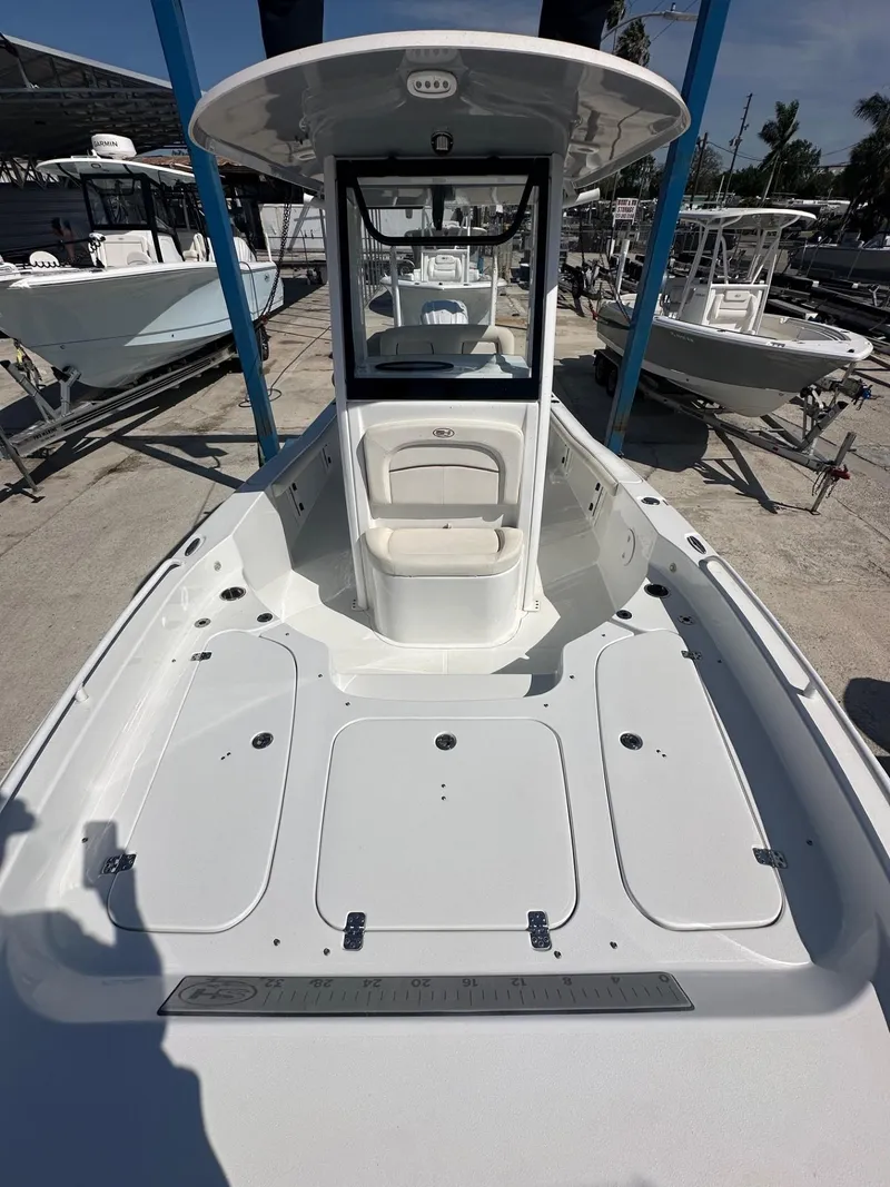 Slide: The Image of 2022 Sea Hunt BX 25 FS boat with spacious deck and center console. - 11