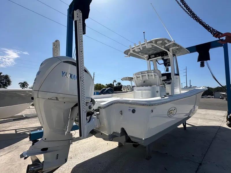 Slide: The Image of 2022 Sea Hunt BX 25 FS boat with Yamaha engine on a sunny day. - 5