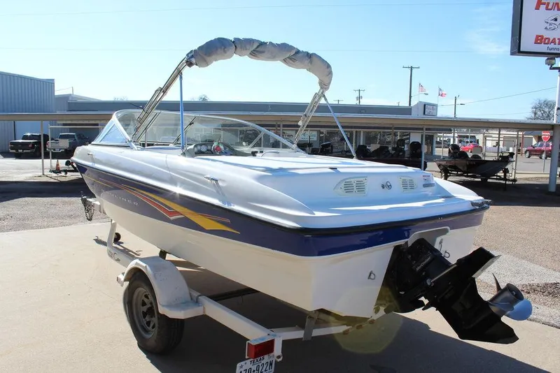 Slide: The Image of 2007 Bayliner 185 BR boat on trailer, displayed outdoors. - 6