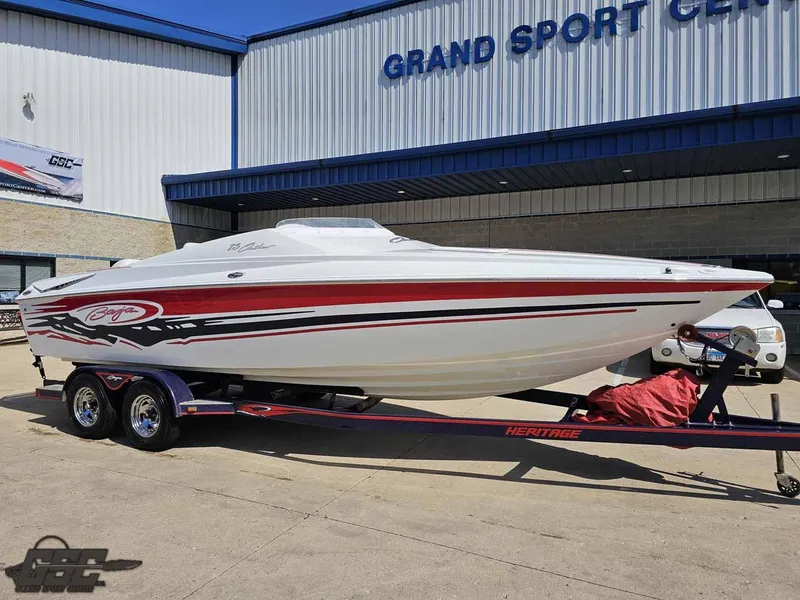 Slide: The Image of 2008 Baja 23 Outlaw boat on trailer at Grand Sport Center. - 12